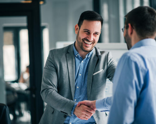 Portrait,Of,Cheerful,Young,Manager,Handshake,With,New,Employee.